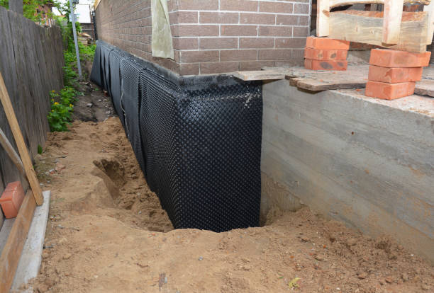 SJ Waterproofing Pros technician performing targeted Exterior Waterproofing assessment in Adger, AL